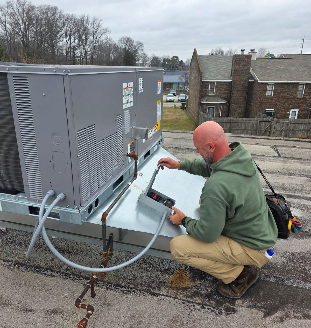 HVAC technician providing heating and air conditioning service in Athens, Alabama